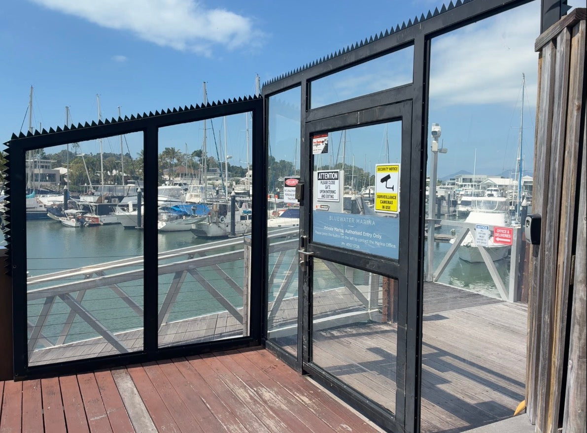 Marina gate with anti climb spikes along the top rail and down the open end of the panel